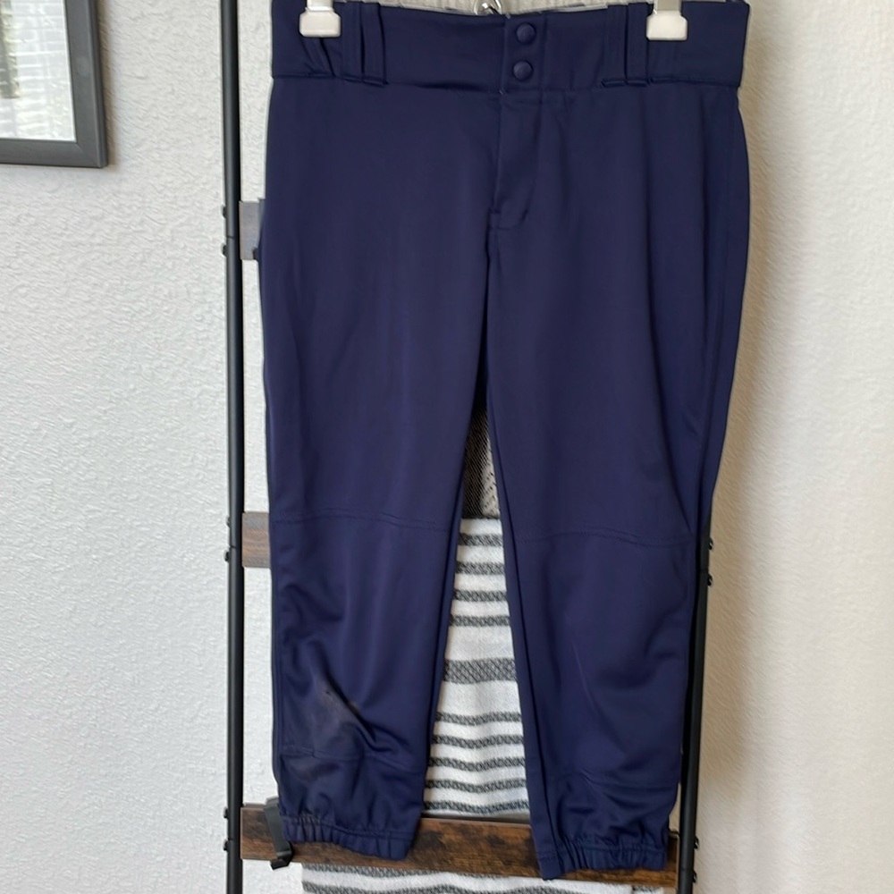 One pair of champaro softball pants, one pair of mizuno sliding shorts.